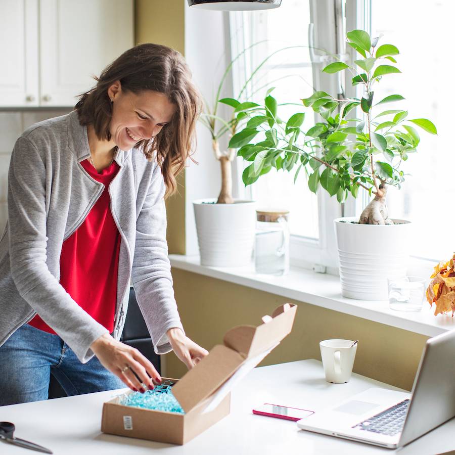 woman opening a package